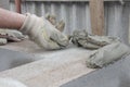Worker aligns with a spatula, lay brick cinderblocks Royalty Free Stock Photo