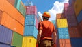 Worker Amidst Shipping Containers Royalty Free Stock Photo