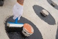 Worker applies bitumen mastic on the foundation