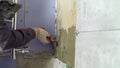 Worker applying cement mortar on bathroom wall Royalty Free Stock Photo