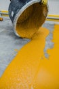 Worker applying epoxy and polyurethane flooring system Royalty Free Stock Photo