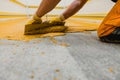 Worker applying epoxy and polyurethane flooring system Royalty Free Stock Photo