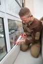 Worker Applying Glue With Silicone Gun