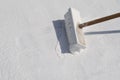 Worker applying white roof coating Royalty Free Stock Photo