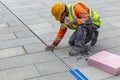 Worker applying silicone sealant