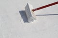 Worker applying white roof coating Royalty Free Stock Photo