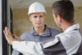 Worker and apprentice installing new window Royalty Free Stock Photo