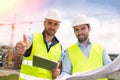 Worker and architect watching some details on a construction