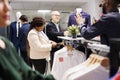 Worker arranging clothes on Black Friday