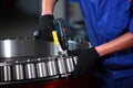 The worker assembles the bearing by hand. Bearing production. Bearing plant. Heavy industry. Beyond recognition. Royalty Free Stock Photo