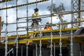 Worker assembling floor formwork on new social housing home unit block at 56-58 Beane St. Gosford, Australia. March 7, 2021. Part Royalty Free Stock Photo