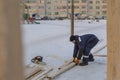 Worker assembling the frame of a wooden slide