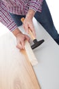 Worker assembling laminate floor Royalty Free Stock Photo