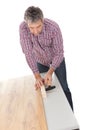 Worker assembling laminate floor Royalty Free Stock Photo