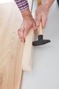 Worker assembling laminate floor Royalty Free Stock Photo