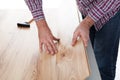 Worker assembling laminate floor Royalty Free Stock Photo