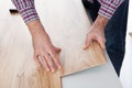 Worker assembling laminate floor Royalty Free Stock Photo