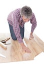 Worker assembling laminate floor Royalty Free Stock Photo