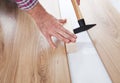 Worker assembling laminate floor Royalty Free Stock Photo
