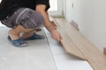 Worker assembling laminate floor Royalty Free Stock Photo