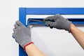 Worker assembling a metal shelf Royalty Free Stock Photo