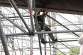 Worker assembling metal structures with safety measures Royalty Free Stock Photo