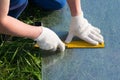 the worker on the Assembly of the greenhouses, said handle , for cutting polycarbonate, outdoors