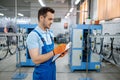 Worker at the assemly line makes bicycle wheels Royalty Free Stock Photo