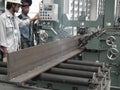 Worker with automatic welding steel beam iron carrier inert gas