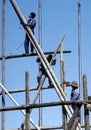 Worker on a bamboo scaffolding