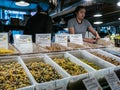 Worker behind pasta display, Pike Place Public Market, Seattle