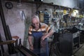 Worker is thrusting a metal sheet Royalty Free Stock Photo