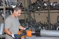 A worker bending pipe