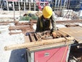 Worker bending rebars