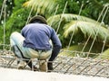 Worker bending steel for construction