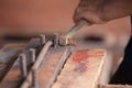 Worker bending steel for construction job