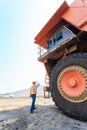 Worker Big Truck in Pit Royalty Free Stock Photo