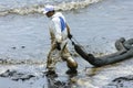 A Worker in biohazard suits used Oil Containment boom as cleani Royalty Free Stock Photo