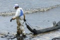 A Worker in biohazard suits used Oil Containment boom as cleani Royalty Free Stock Photo