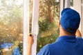 Worker installing new plastic pvc window Royalty Free Stock Photo