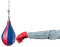 Worker with boxing glove punches punching bag Royalty Free Stock Photo