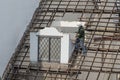 Worker breaking a house down with his hammer in Vietnam