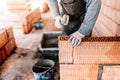 worker, bricklayer and mason working with bricks and building interior walls of house Royalty Free Stock Photo