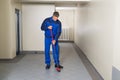 Worker With Broom Cleaning Office Corridor Royalty Free Stock Photo