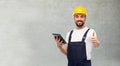 Worker or builder with tablet pc showing thumbs up Royalty Free Stock Photo