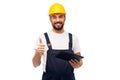 Worker or builder with tablet pc showing thumbs up Royalty Free Stock Photo