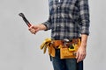 Worker or builder with wrench and tools on belt Royalty Free Stock Photo