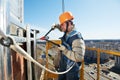 Worker builders at facade tile installation Royalty Free Stock Photo