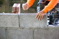 Worker building masonry house wall with bricks Royalty Free Stock Photo