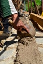 Worker building wall with ladle mortar Royalty Free Stock Photo